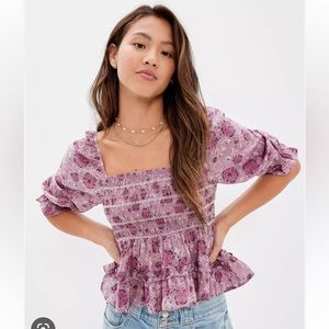 Short sleeve purple floral AE top.